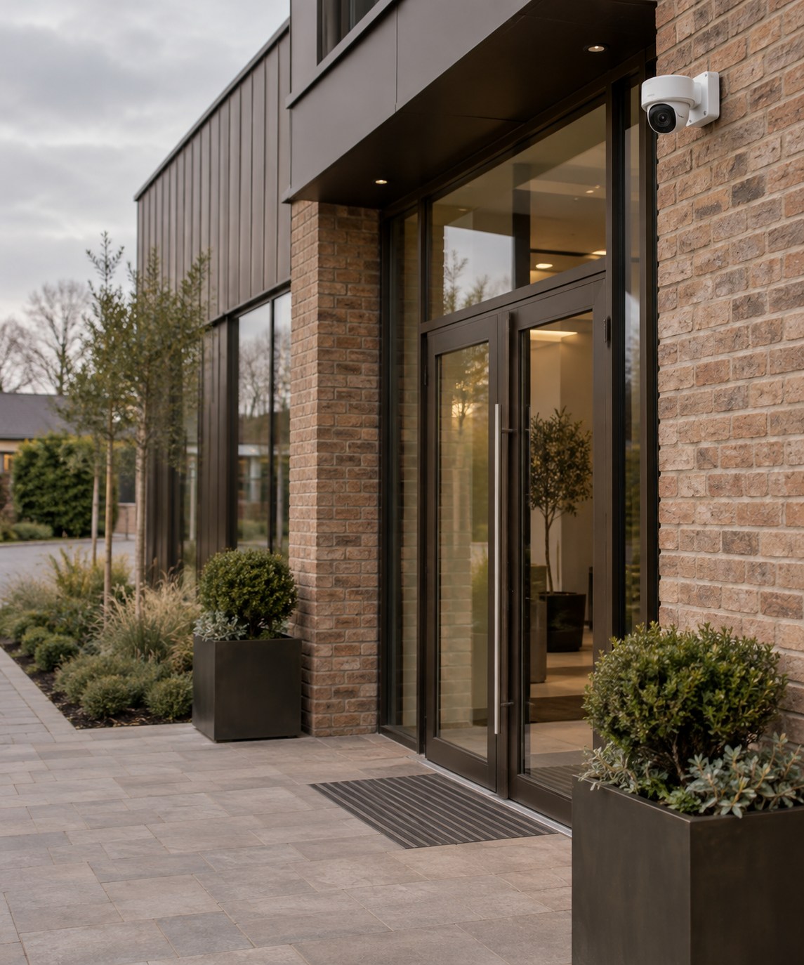 Illustrative brick and glass business premises